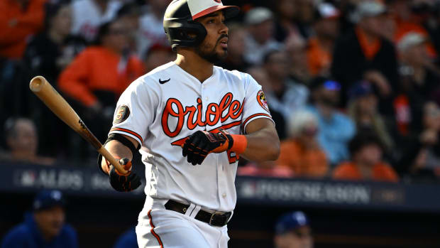 Oct 7, 2023; Baltimore, Maryland, USA; Baltimore Orioles designated hitter Anthony Santander (25) hits a home run against the Texas Rangers during the sixth inning in game one of the ALDS for the 2023 MLB playoffs at Oriole Park at Camden Yards. Mandatory Credit: Tommy Gilligan-USA TODAY Sports